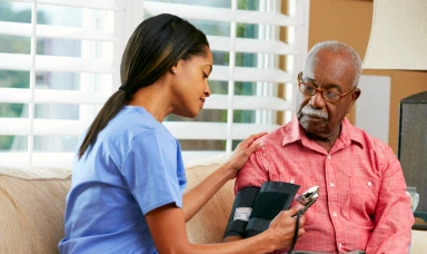 old man having his blood pressure checked